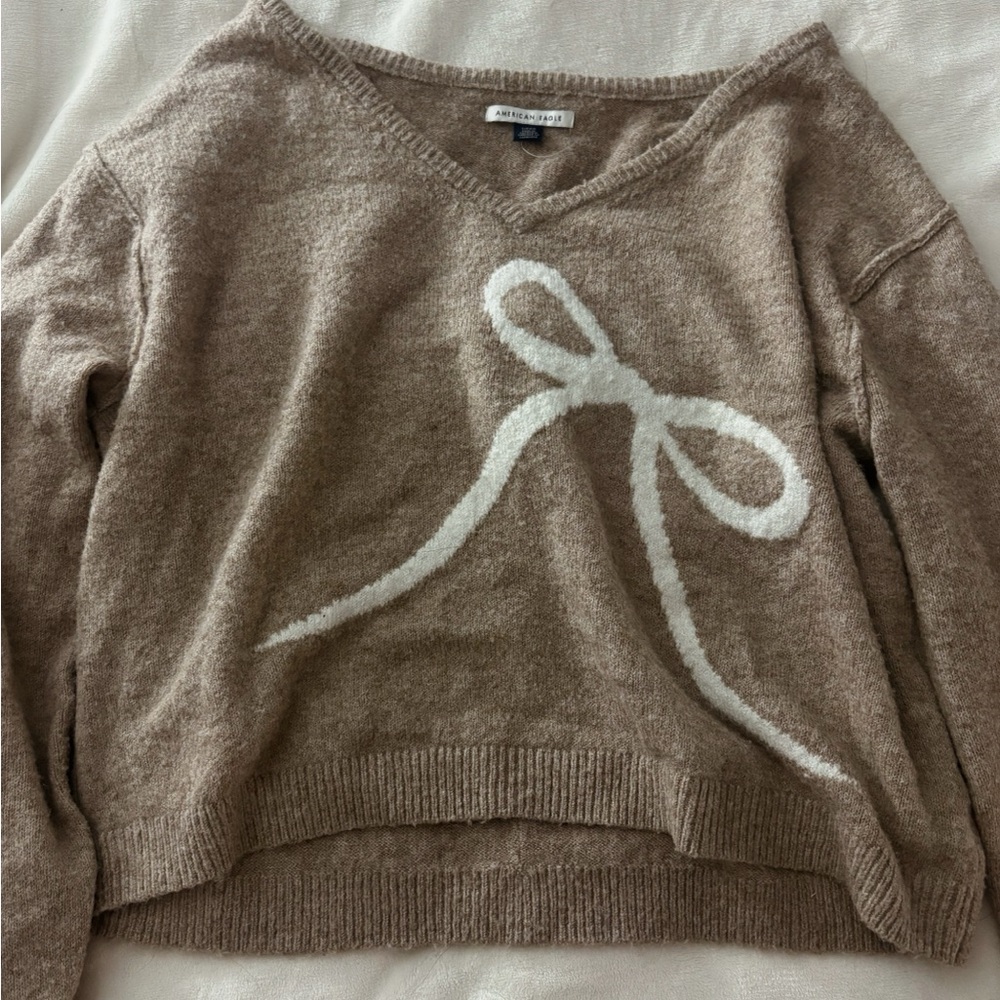 American Eagle Outfitters Tan V-Neck Sweater with White Bow